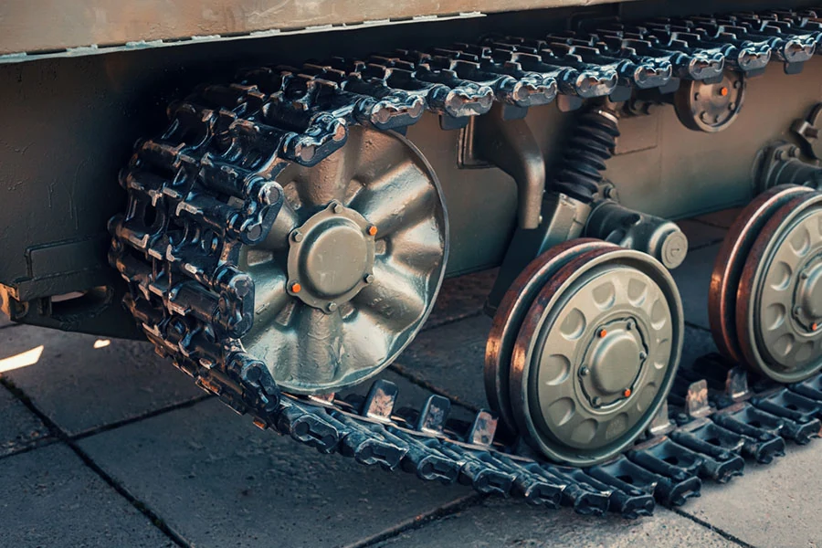 Tracked running gear and suspension components